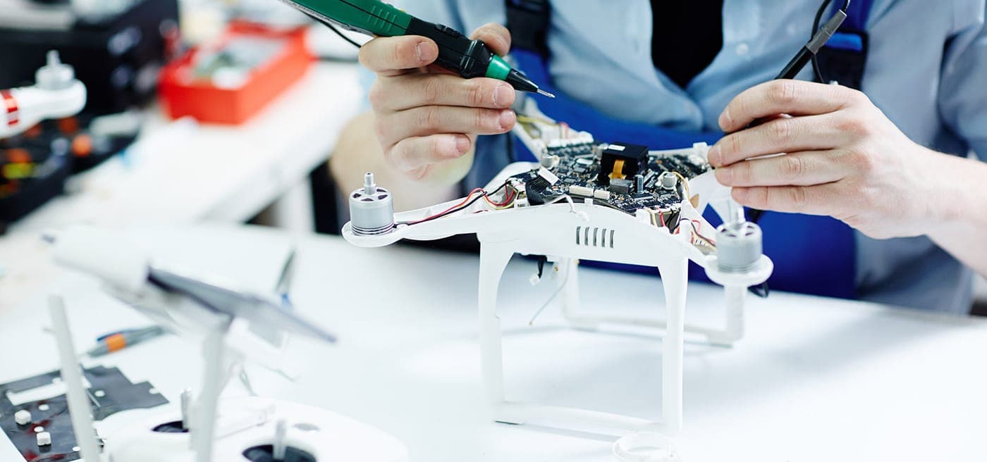 Engineers building and testing unmanned systems